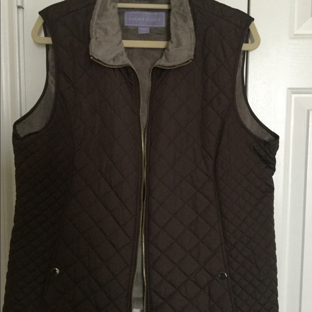 Brown vest with silver lining.